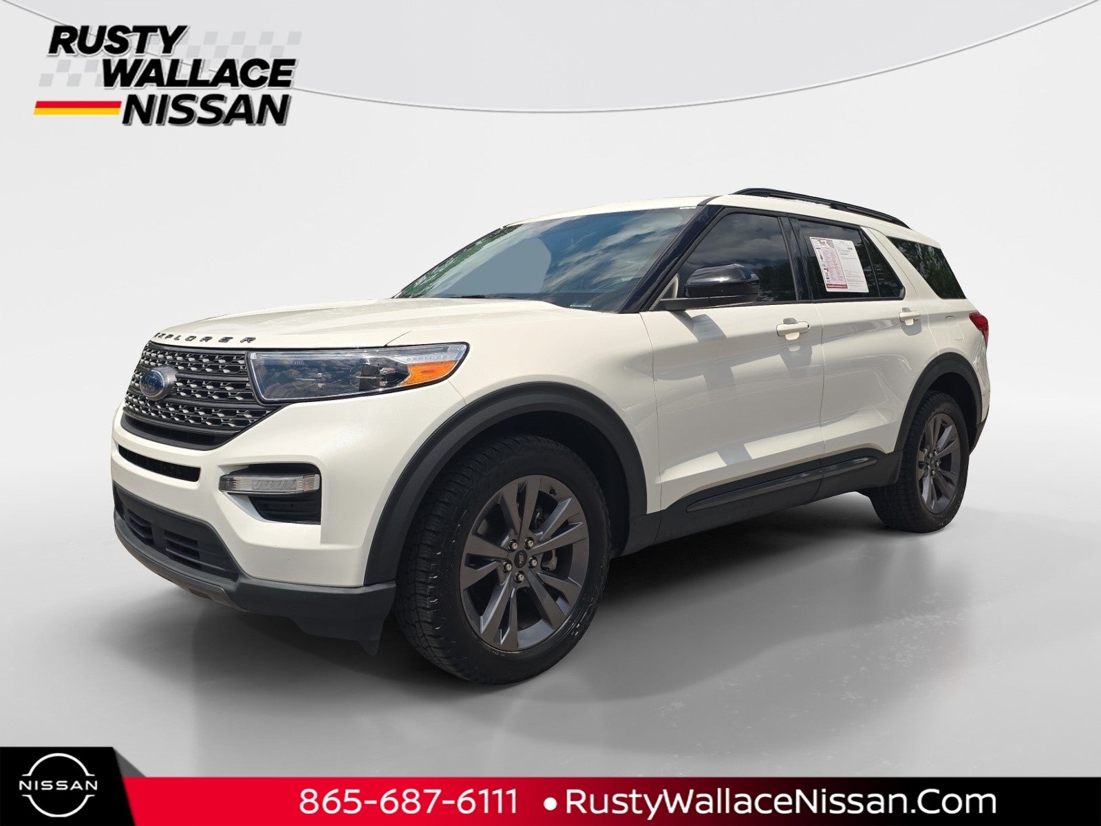 2022 Ford Explorer XLT in Star White Met Tri-Coat — front three-quarter view