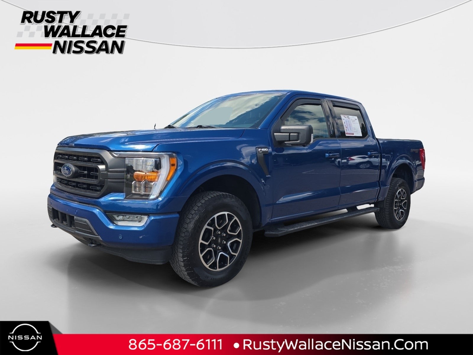 2022 Ford F-150 XLT in Atlas Blue Metallic — front three-quarter view