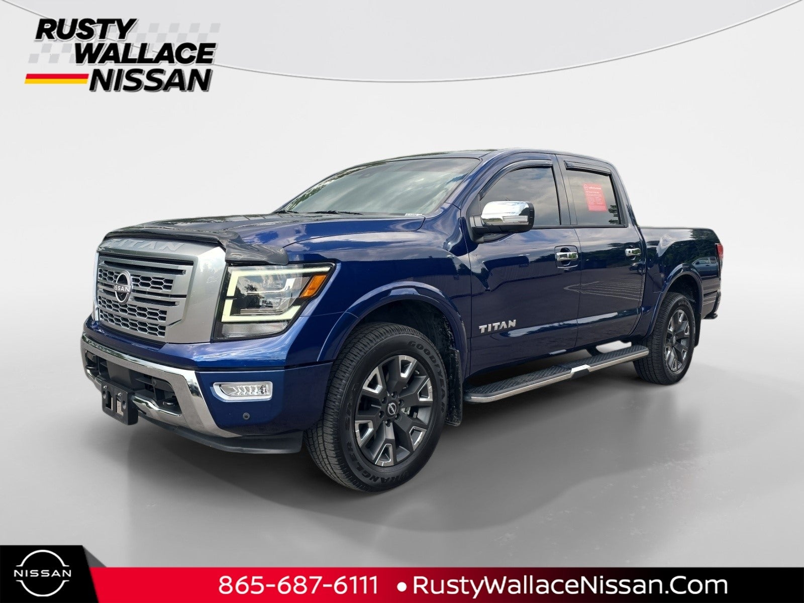 2023 Nissan Titan Platinum Reserve in Deep Blue Pearl — front three-quarter view