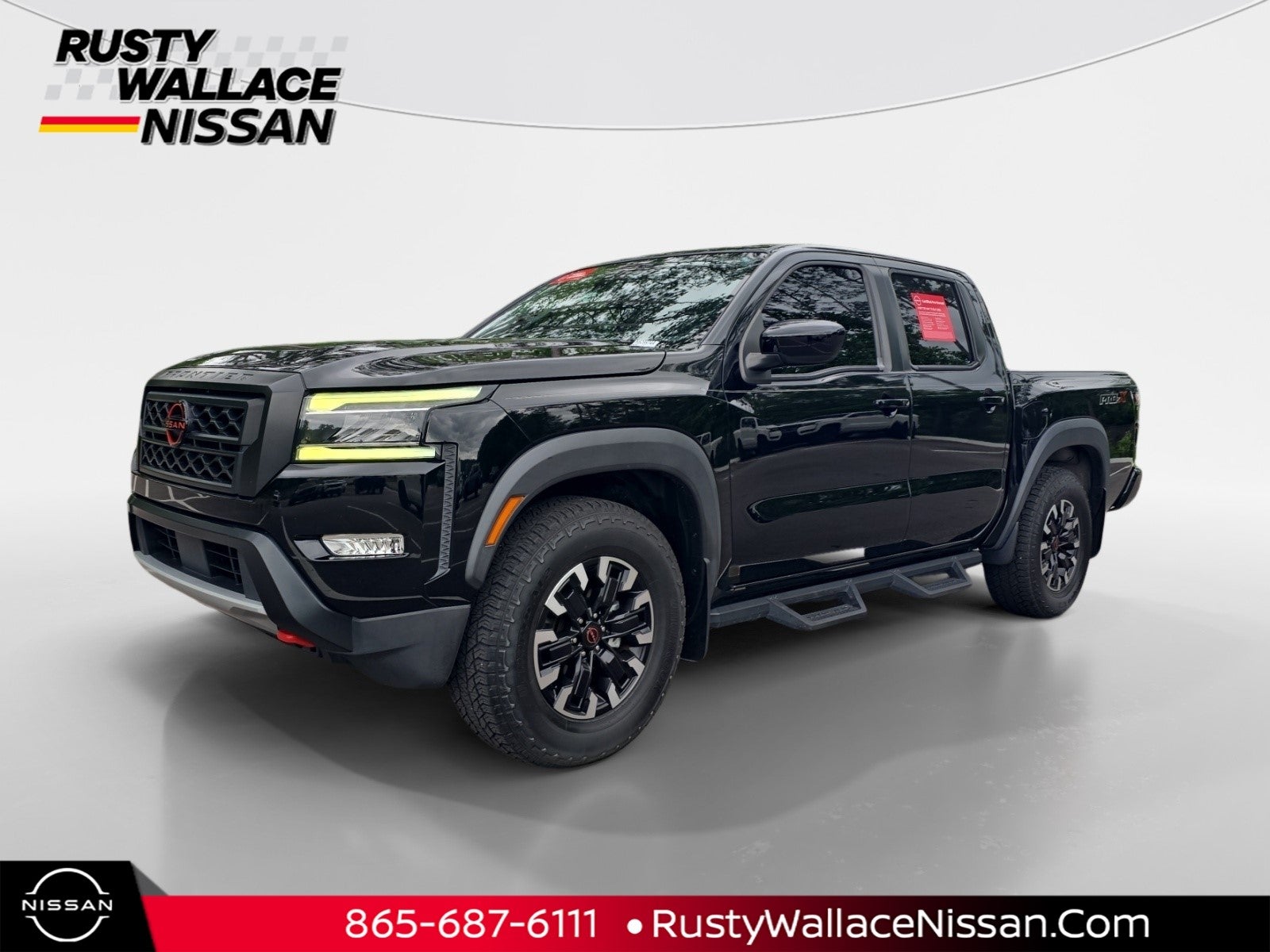 2023 Nissan Frontier PRO-X in Super Black — front three-quarter view