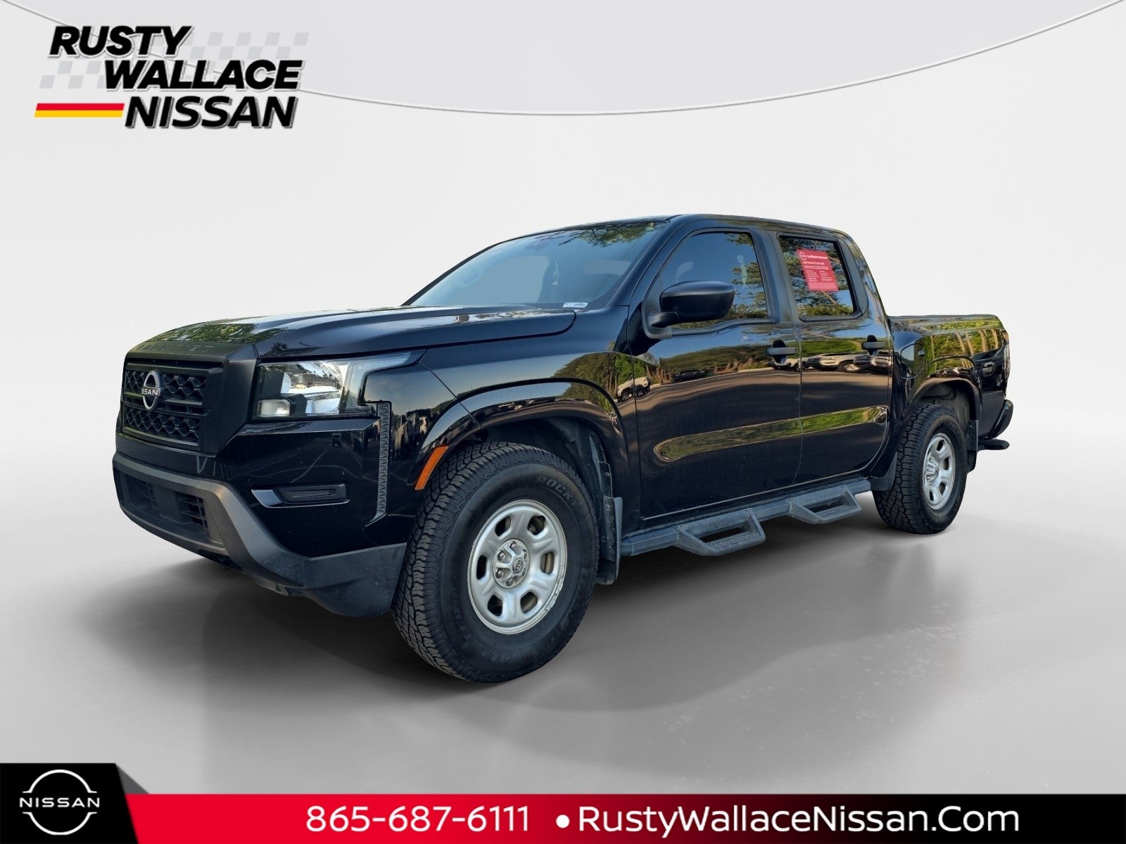 2022 Nissan Frontier S in Super Black — front three-quarter view