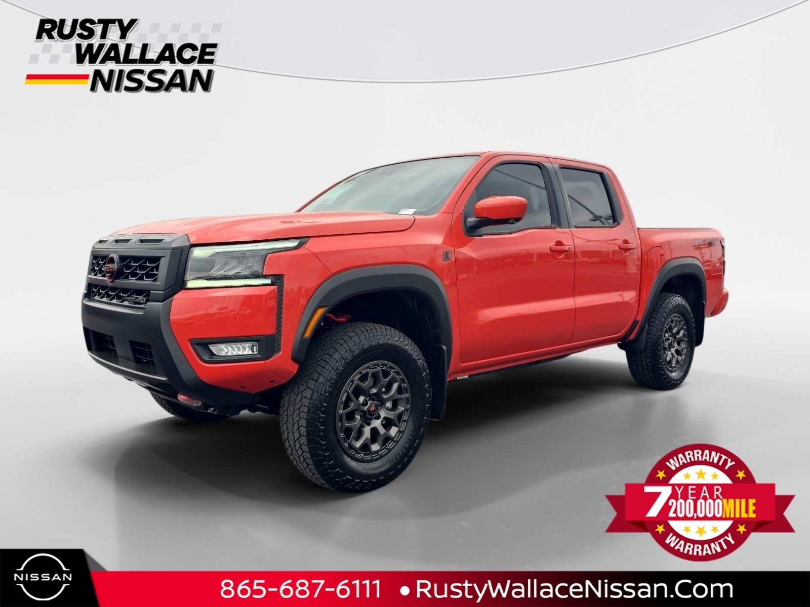 2026 Nissan Frontier PRO-4X w/R Package in Afterburn Orange — front three-quarter view