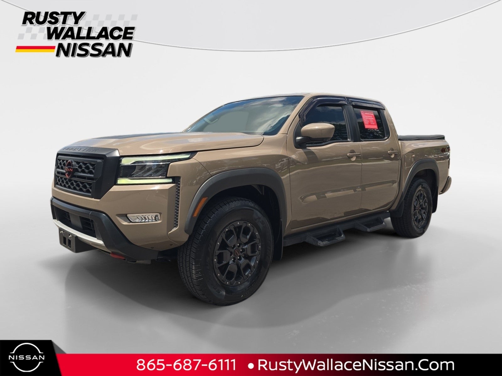2023 Nissan Frontier PRO-4X in Baja Storm — front three-quarter view