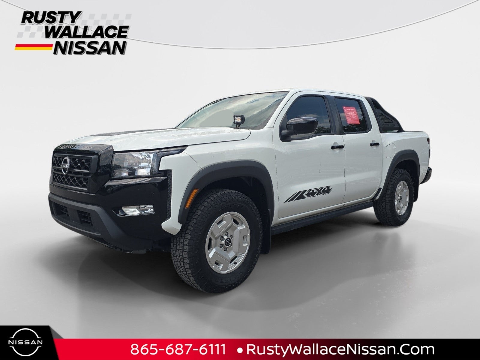 2024 Nissan Frontier SV HARDBODY in Glacier White — front three-quarter view