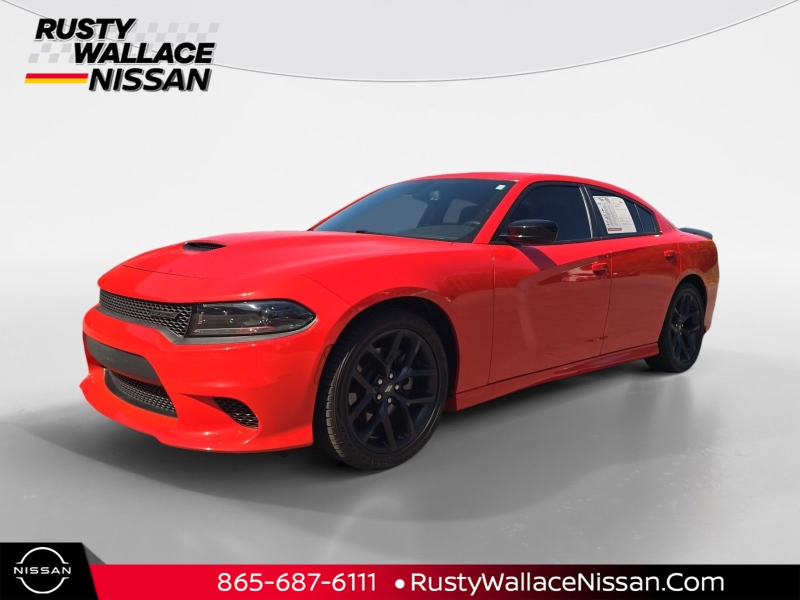 2023 Dodge Charger GT in Go Mango — front three-quarter view