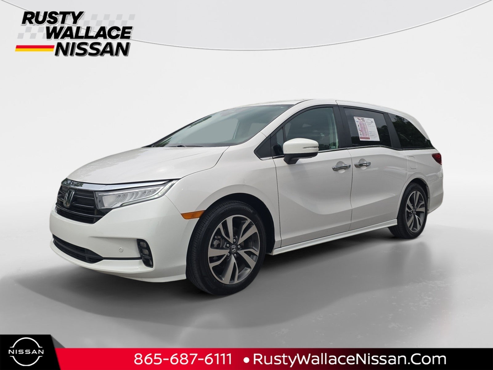2024 Honda Odyssey Touring in White — front three-quarter view