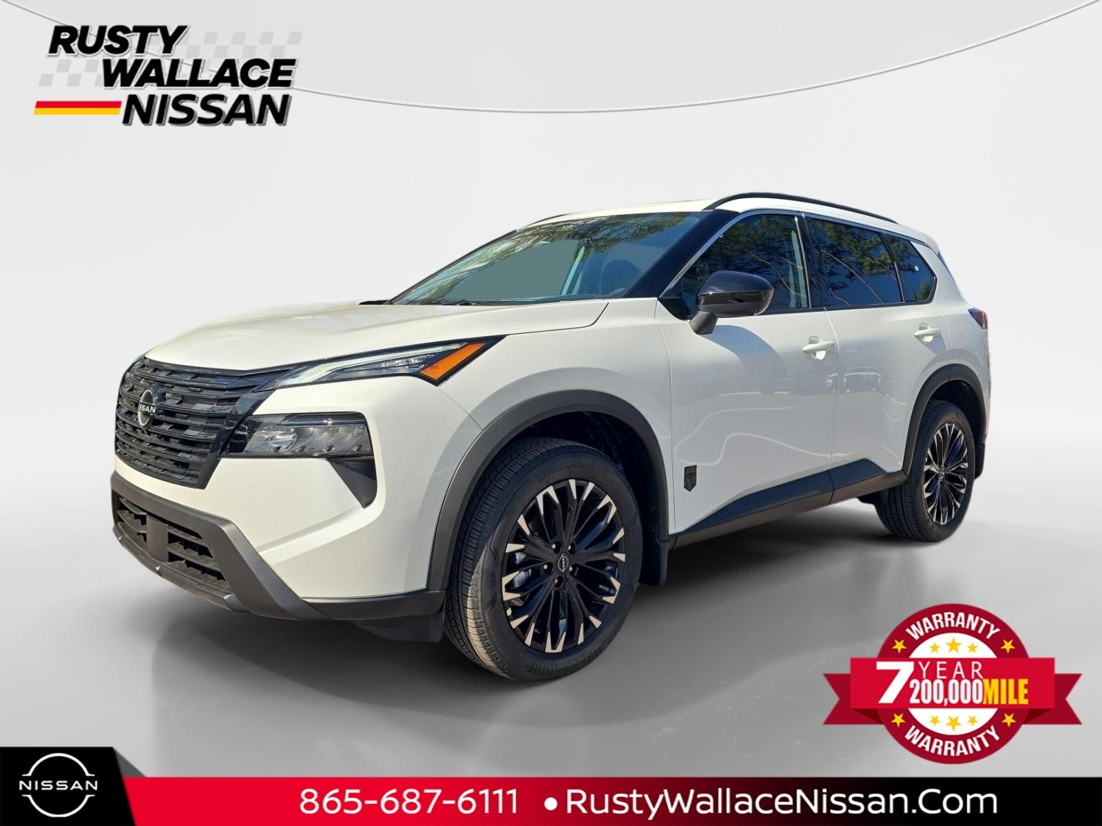 2026 Nissan Rogue Dark Armor in Everest White Pearl Tricoat — front three-quarter view