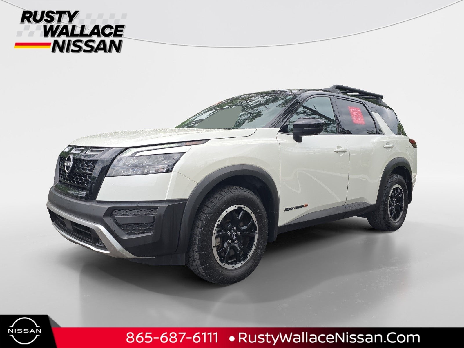 2023 Nissan Pathfinder Rock Creek in Pearl White Tricoat/Super Black — front three-quarter view