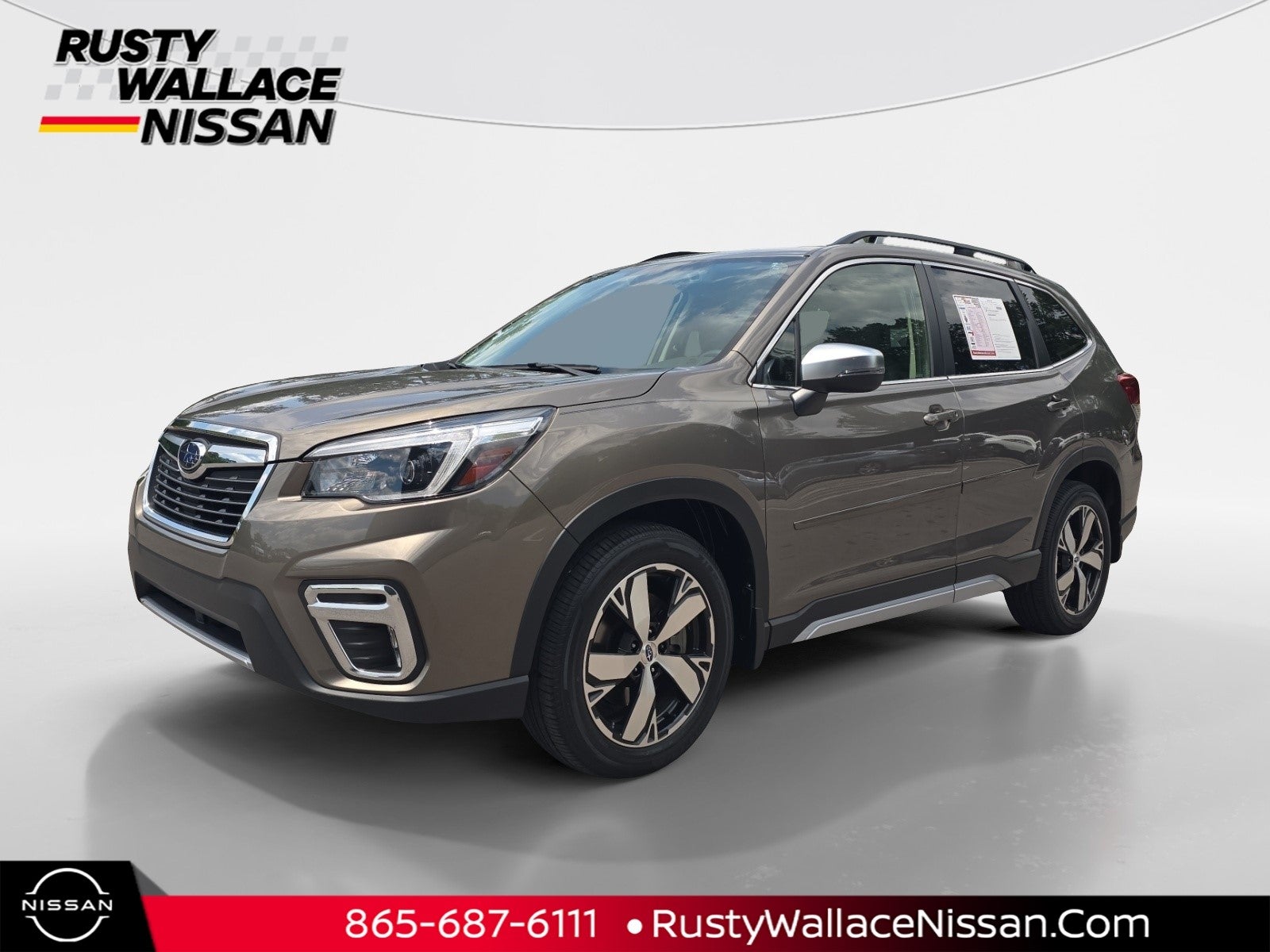 2021 Subaru Forester Touring in Sepia Bronze Metallic — front three-quarter view