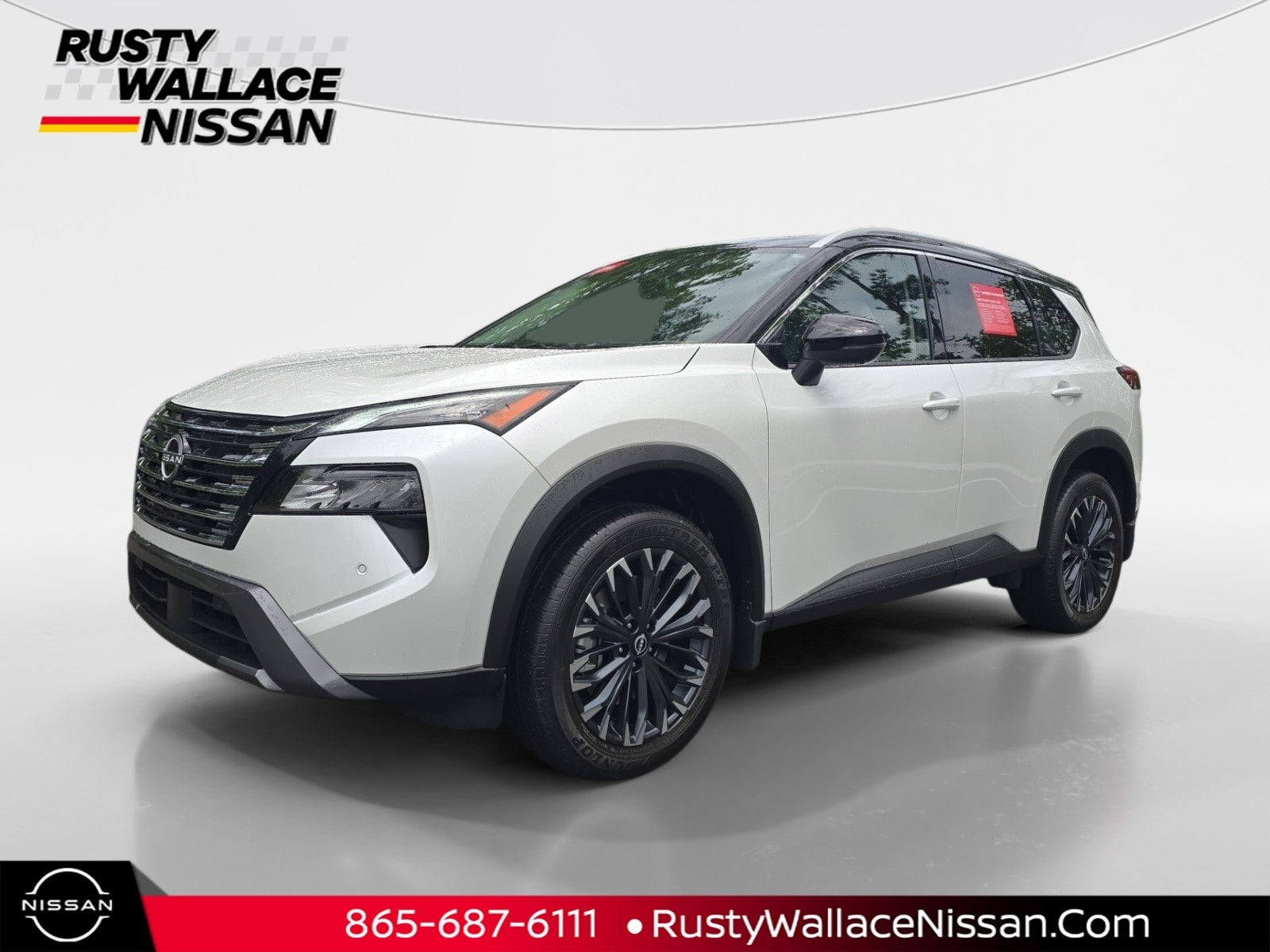 2025 Nissan Rogue SL in Everest White Pearl/Super Black — front three-quarter view