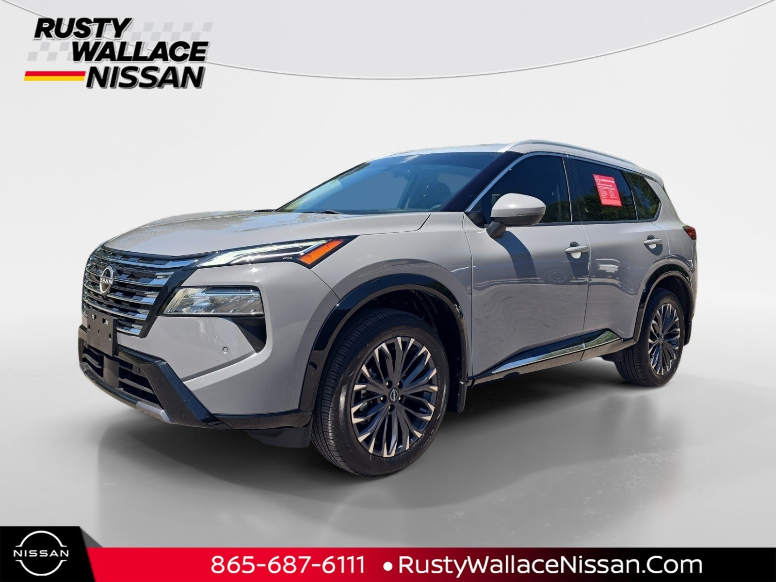 2024 Nissan Rogue Platinum in Boulder Gray Pearl — front three-quarter view